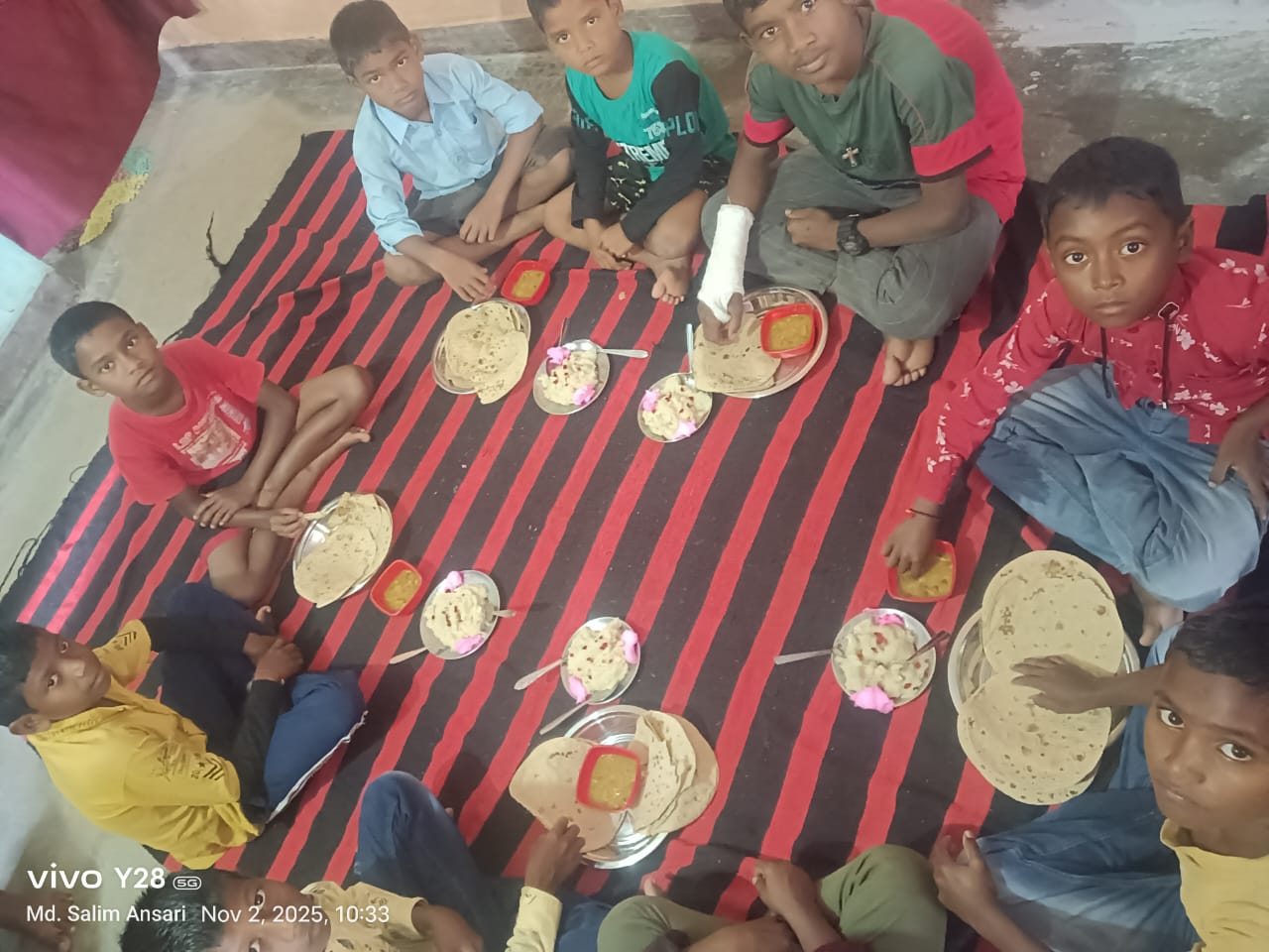 Children receiving food distribution outside